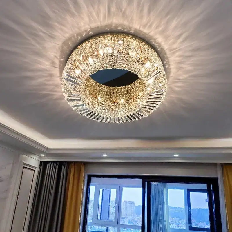 Modern golden led crystal ceiling lamp with gold-toned frame and radiating glass prisms for living room decorbites ceiling lamp