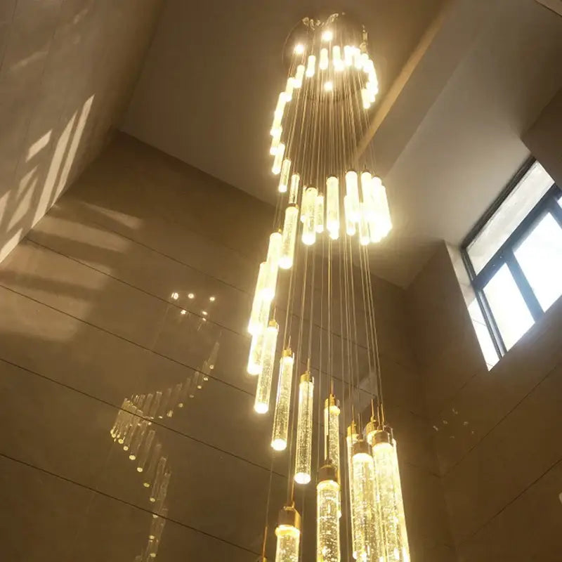 Modern golden led crystal chandelier with cascading cylindrical glass pendants for living room staircase decorbites golden led