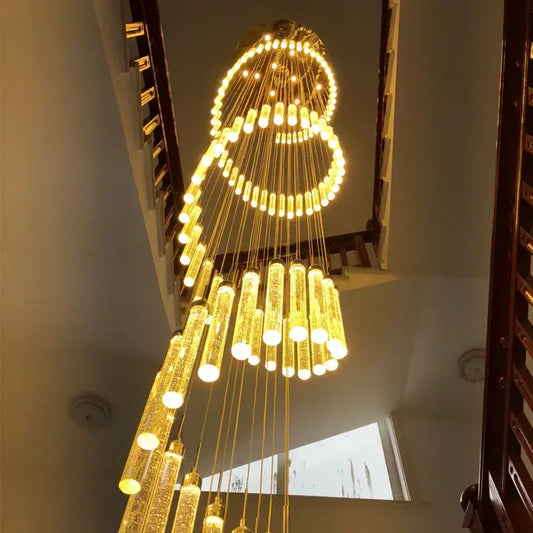 Modern golden led crystal chandelier featuring cascading cylindrical crystal pendants and circular light rings for living room staircase decorbites golden led