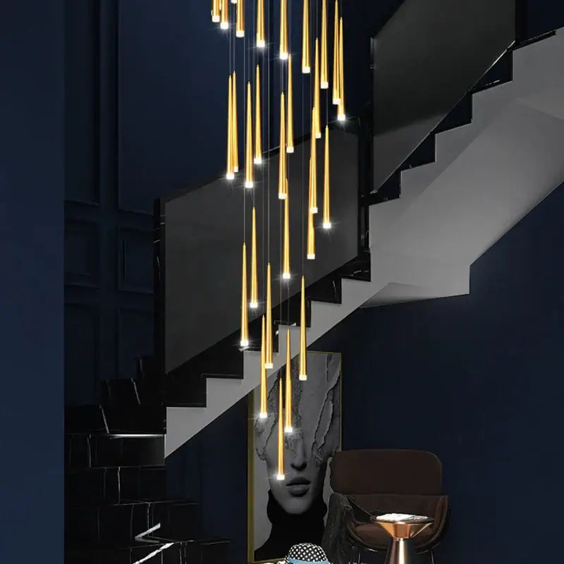 Modern golden led tapered chandelier with cylindrical pendant lights in cascading arrangement for living room decorbites golden led