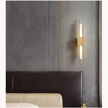 Modern golden led wall lamp with gold-toned vertical rectangular light bars and central square accent for bedroom decorbites lighting