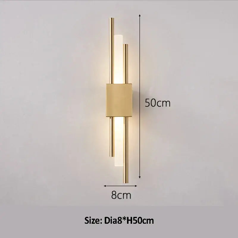 Modern golden led wall lamp with minimalist gold-toned rods and illuminated bar for bedroom ambient lighting decorbites golden led