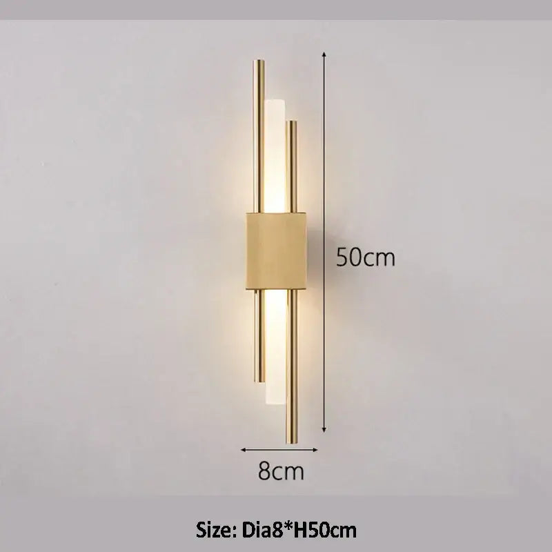 Modern golden led wall lamp with sleek gold-toned rods and frosted glass panels for bedroom ambient lighting decorbites golden led