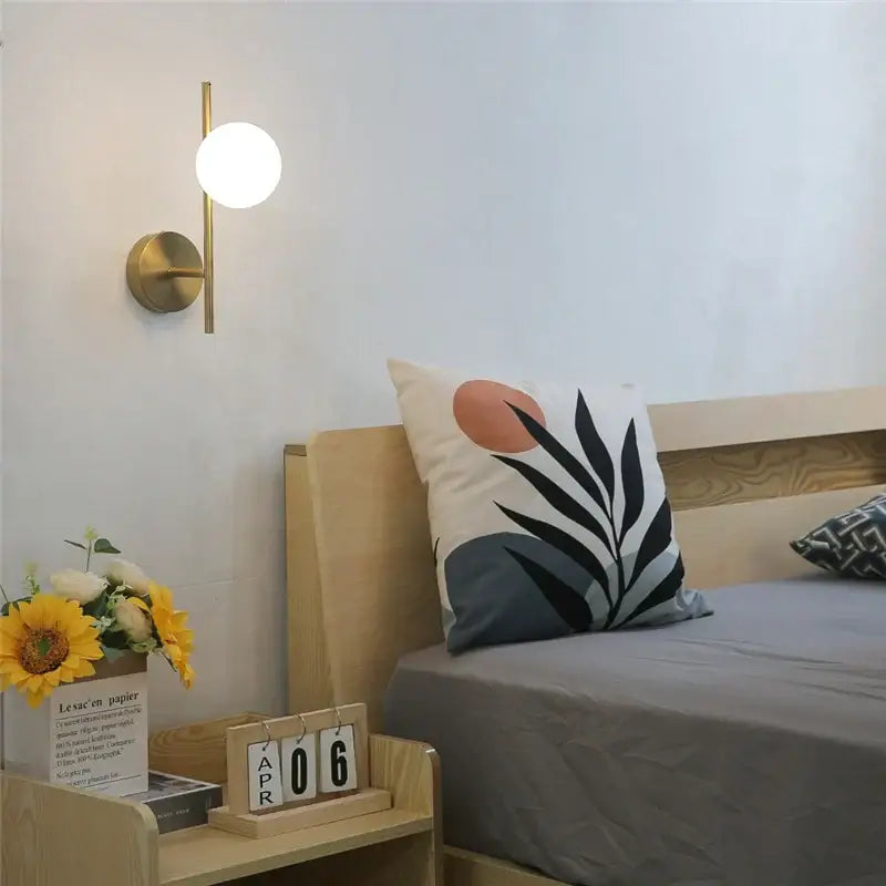 Modern brass wall lights with milky glass spheres by decorbites golden led for elegant bedroom decorbites golden led wall