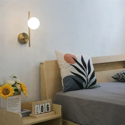 Modern brass wall lights with milky glass spheres by decorbites golden led for elegant bedroom decorbites golden led wall