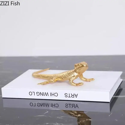 Modern golden lizard sculpture with detailed scales and textured surface metal desk ornament for living room decor