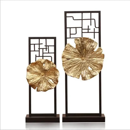 Modern golden lotus leaf framed sculpture featuring golden metallic lotus leaf mounted on black stands for living room decor