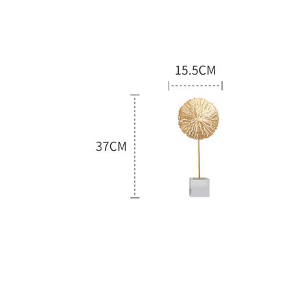 Modern golden lotus sculpture featuring an intricately textured gold metal lotus sculpture on a white base for living room decor