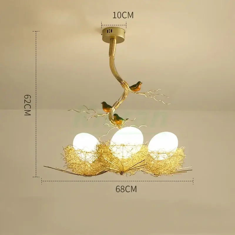 Modern golden nest glass led ceiling lamp with three glowing white lights and decorative bird accents for living room decor