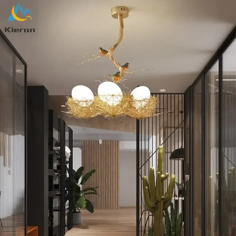 Modern golden nest glass led ceiling lamp featuring a bird-themed design with three white glass bulbs for living room decor