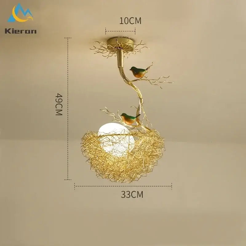 Gold-toned metal ceiling lamp with intricate branch design and two green and orange birds for living room decor