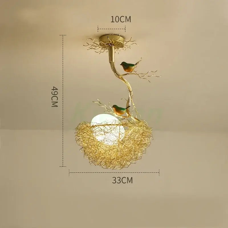 Modern golden nest glass led ceiling lamp with intricate branch design and two green and orange birds for living room decor