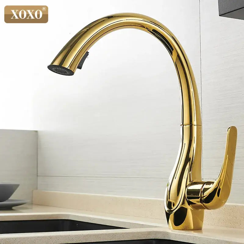 Modern golden pull kitchen faucet with curved spout and pull-down spray head for sleek water mixing decorbites golden pull