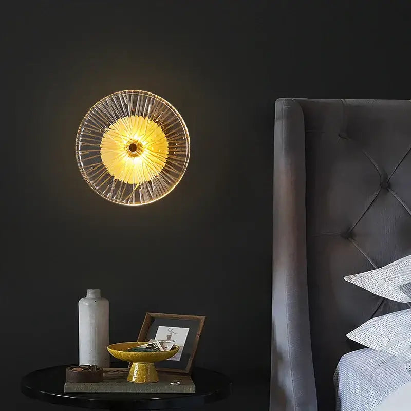 Modern golden radial crystal wall lamp featuring a circular glass wall sconce with clear ribbed panels decorbites crystal wall lamp
