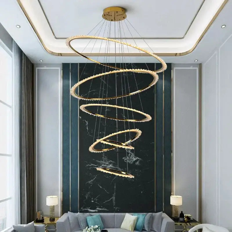 Modern golden spiral decorbites crystal chandelier with interlocking rings and embedded led lights for living room lighting