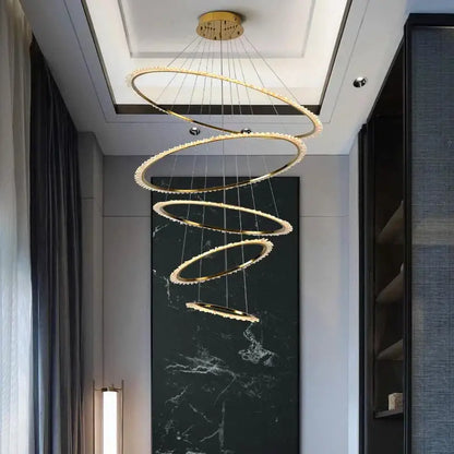 Modern golden spiral decorbites crystal chandelier with crystal accents hanging from ceiling mount for living room light