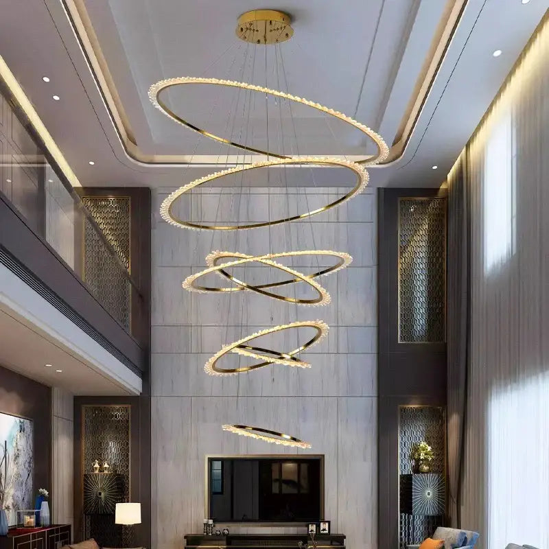 Modern golden spiral decorbites crystal chandelier with crystal accents hanging from ceiling for living room lighting
