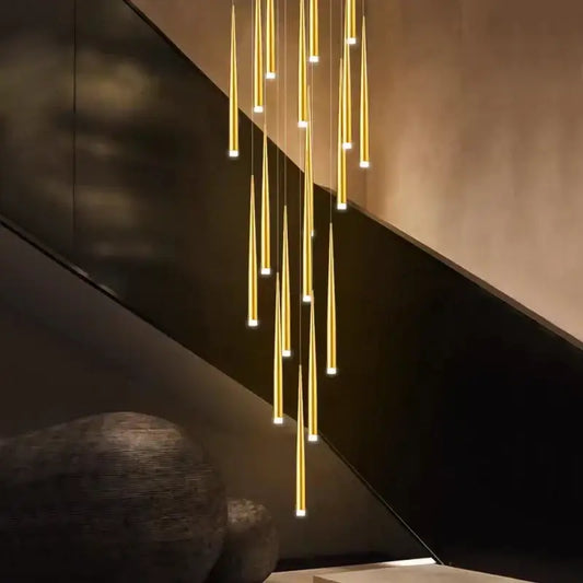 Modern golden tapered led chandelier featuring slender pendant lights in an elegant cascade for living room decorbites golden tapered design