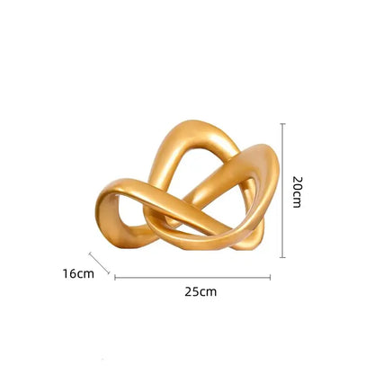 Modern golden twisted dough rope knot sculpture with smooth intertwined loops for living room decor