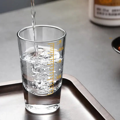 Clear glass spirit set measuring cup with yellow chinese markings for modern brandy cups and dining use