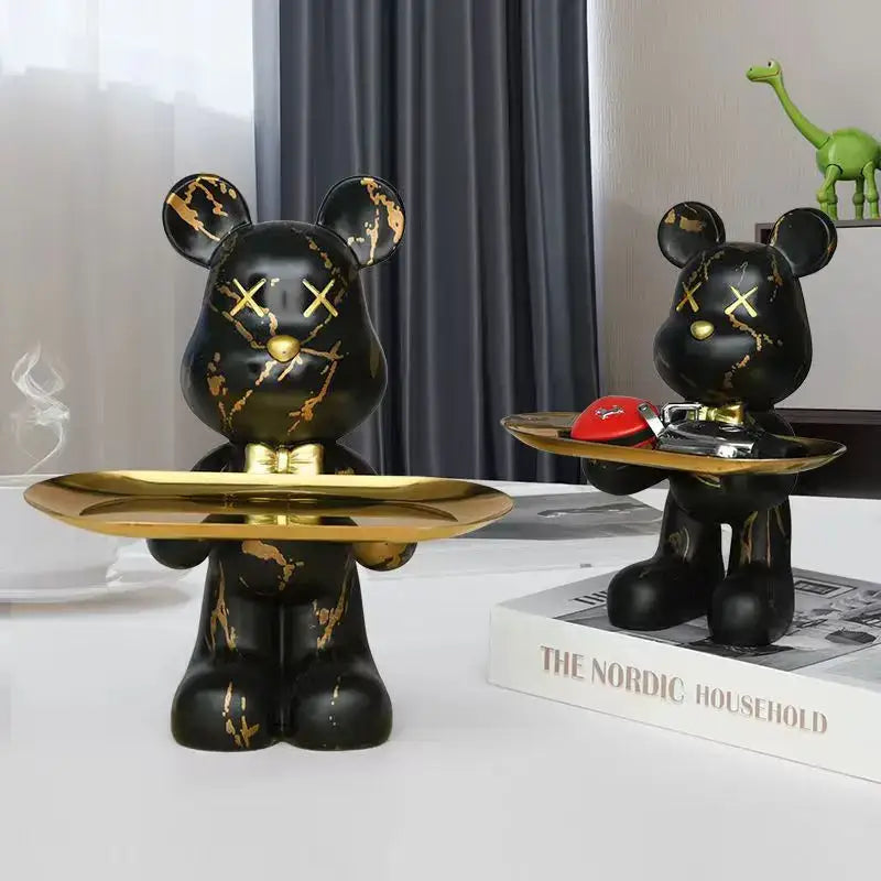 Black bear figurine with gold marble streaks and x-shaped eyes holding a golden tray modern graffiti bear decorbites storage decor