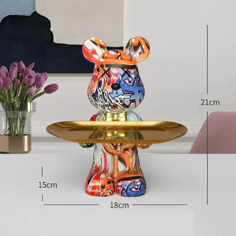 A vibrant decorbites graffiti bear figurine in colorful graffiti style with a gold tray for living room storage decor