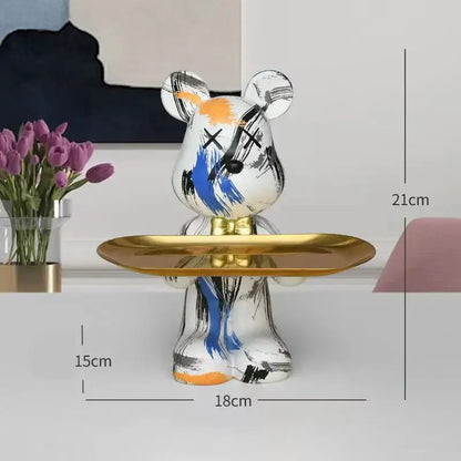 White ceramic graffiti bear figurine with black blue orange brushstrokes holding gold tray modern decorbites decorbites graffiti bear