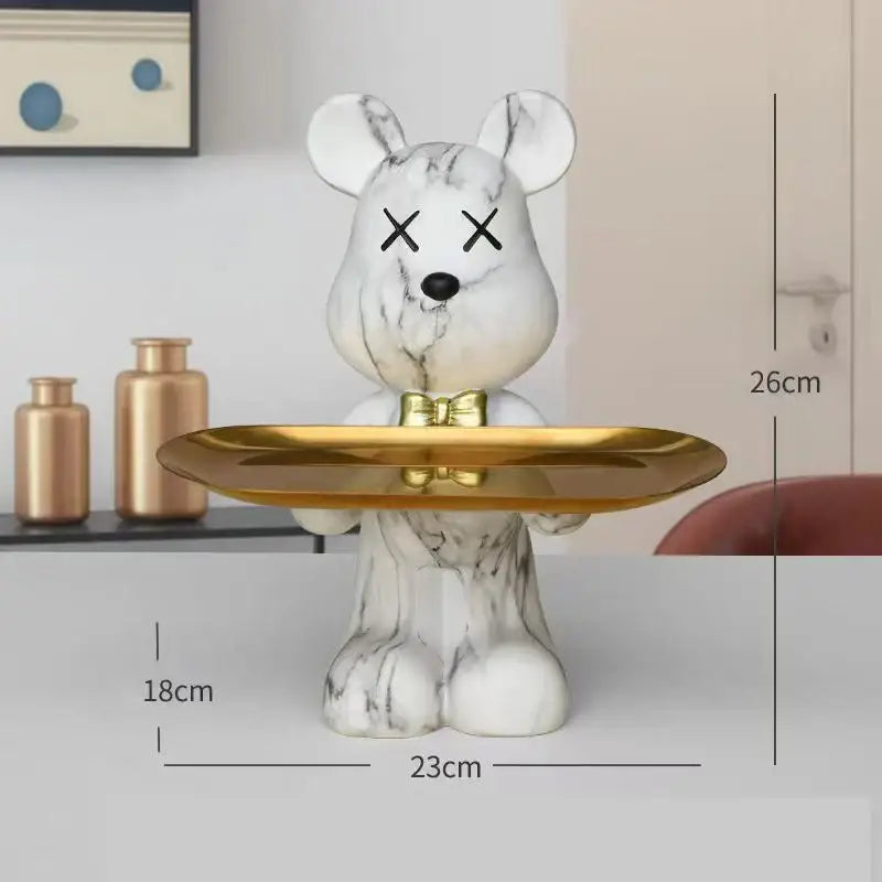 White marble graffiti bear figurine with black x eyes and gold bow tie holding tray for modern living room decorbites decor