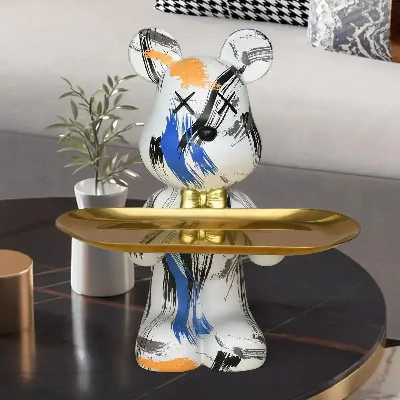 Modern graffiti bear figurine white ceramic with black blue orange brushstrokes x’d eyes gold bow tie holding tray decorbites bear figurine