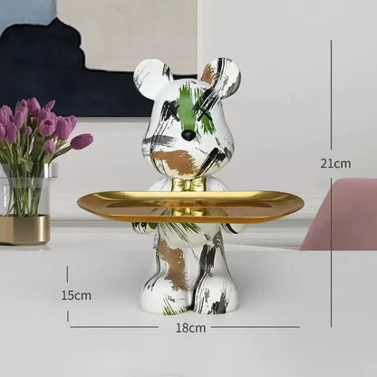 White ceramic bear figurine with abstract green black and gold brushstroke holding a shiny golden tray decorbites graffiti bear
