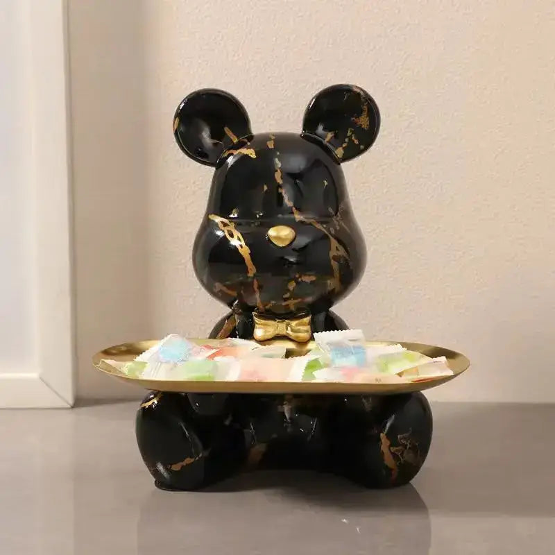 Black marble-effect bear figurine with gold veining and golden bow tie holding brass tray for living room decorbites graffiti bear