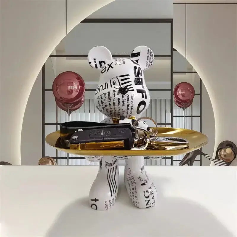 Modern white bear statue ornament with black typographic print holding a gold tray and keys for home decor