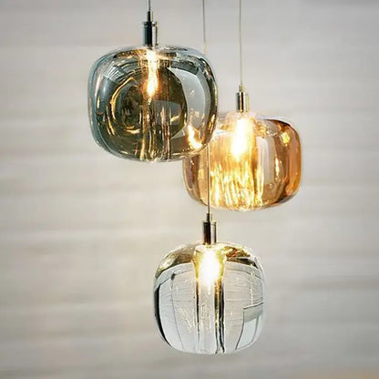 Three modern gray amber and clear crystal pendant lights with frosted textured finish for bedroom kitchen decorbites light luxury