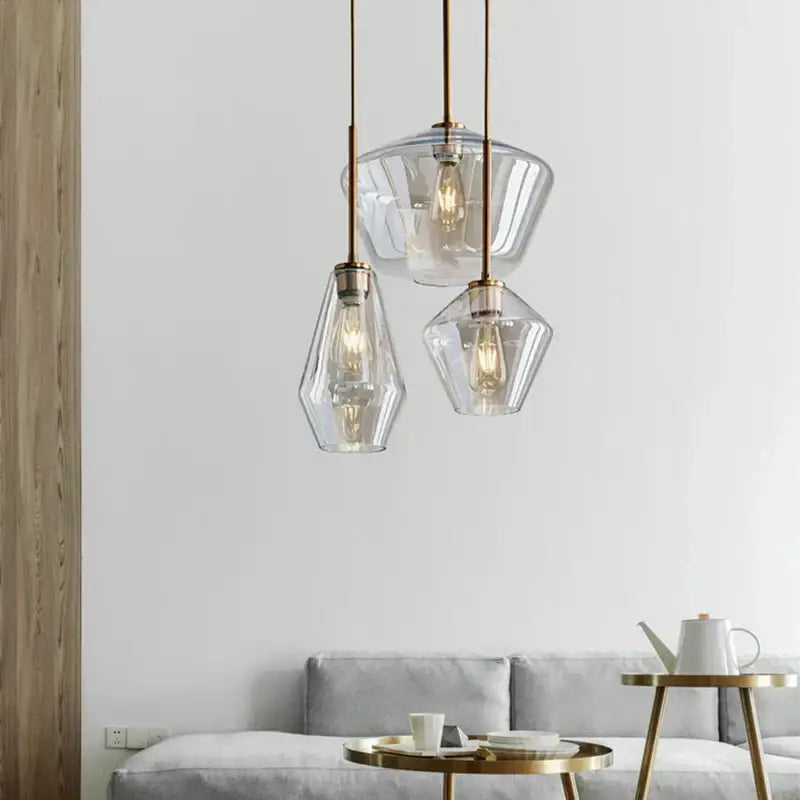 Modern gray amber glass pendant lamp with brass accents for dining room lighting by decorbites gray amber