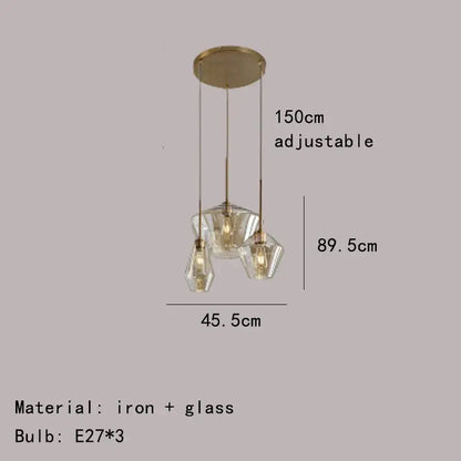 Modern gray amber glass pendant lamp with gold-toned iron and three faceted crystal shades decorbites gray amber decor