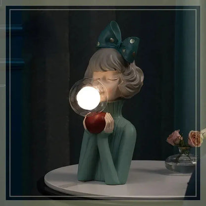 Modern gray and gold bubble girl statue night light featuring a teal resin girl statue ornament holding a glowing orb decorbites bubble girl