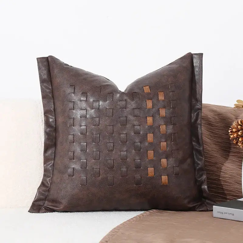 Brown leather throw pillow with woven rectangular pattern complementing modern gray and white leaf cushion cover decorbites black white sofa decor