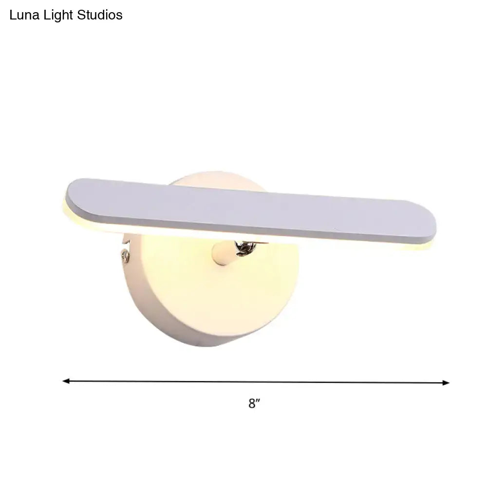 Modern gray and white linear vanity lighting wall sconce with a sleek matte gray rectangular light bar on white wall