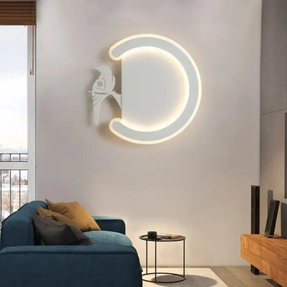 A modern white crescent-shaped wall lamp with a glowing led ring and warm white light for bedroom use
