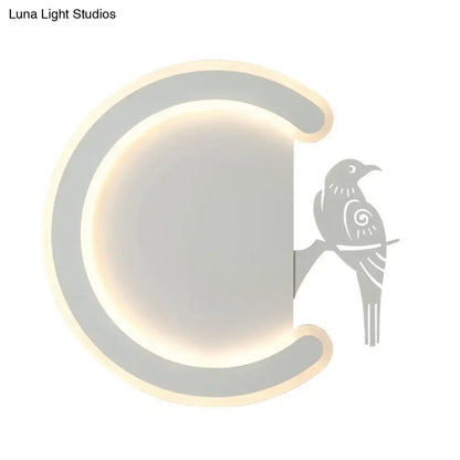 Modern gray wall lamp with a sleek curved frame and warm white light featuring a stylized bird silhouette