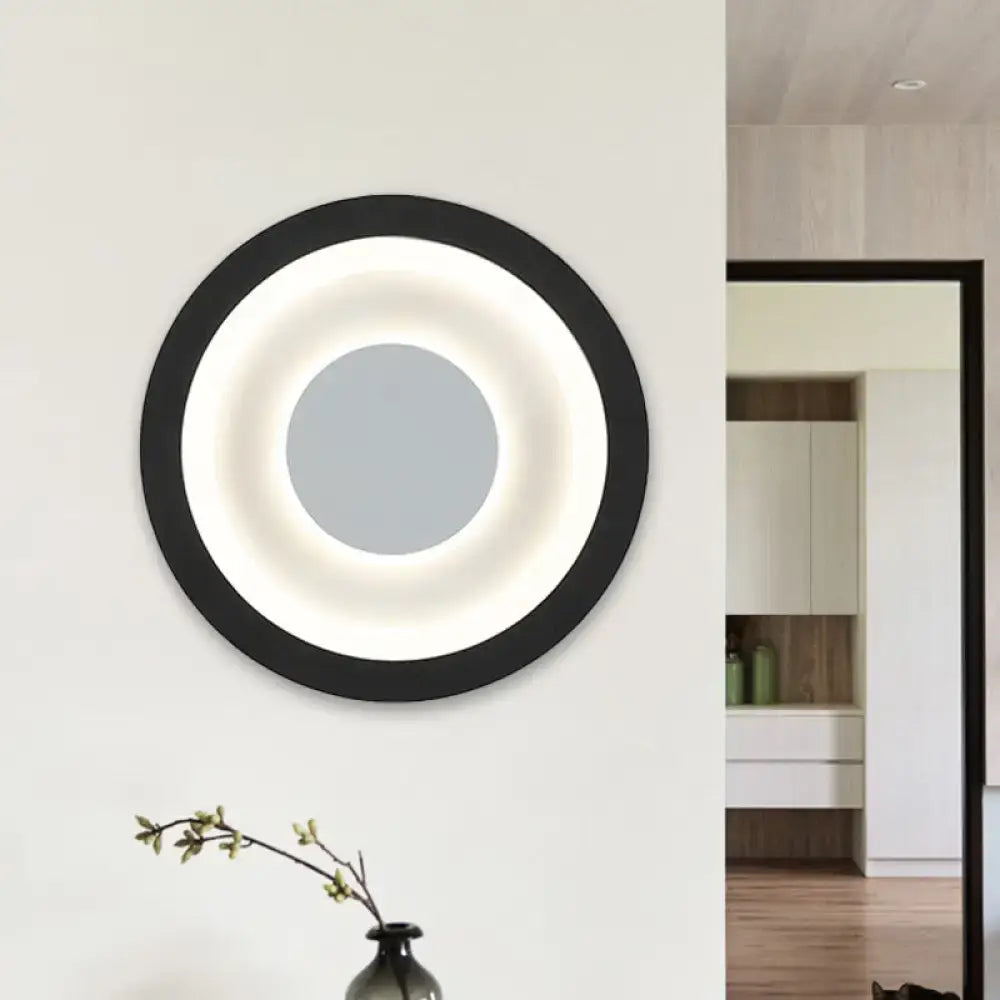 Modern gray and black living room wall mounted lamp with a black frame circular mirror and illuminated led circle sconce light