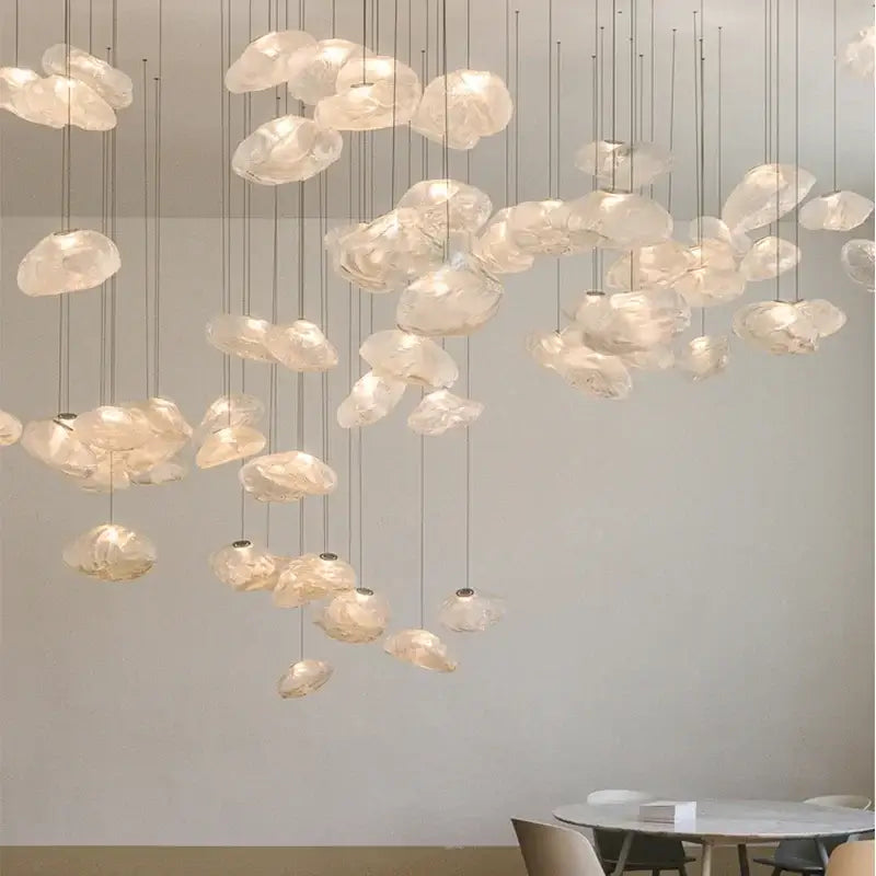 Modern gray cloud glass pendant lights with delicate translucent shades and soft glow hanging in living room decorbites cloud glass