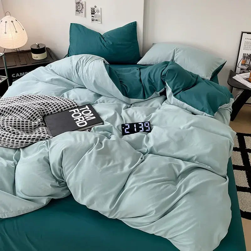 Modern gray comforter cover set featuring a teal and light blue two-tone quilted cover set with matching pillowcases