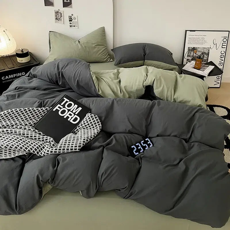 Modern gray comforter cover set with plush quilted fabric and olive green accent pillow for bedroom bedding