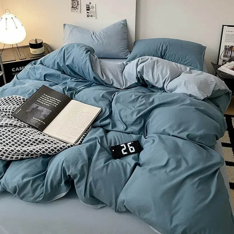 Modern gray comforter cover set with cozy teal duvet and pillows featuring soft slightly wrinkled fabric texture