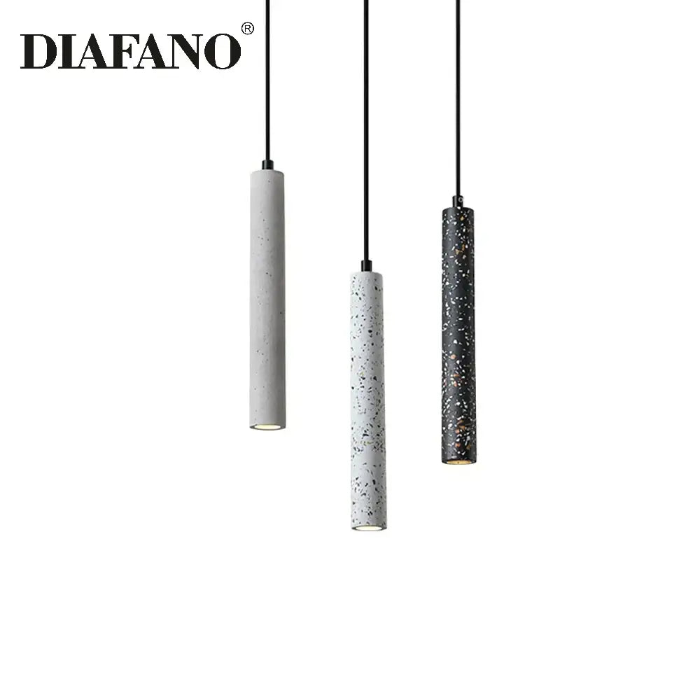 Modern gray concrete tube pendant light featuring three cylindrical speckled concrete shades in gray white and black for dining room decorbites concrete tube pendant chandelier