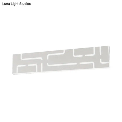 A sleek modern gray geometric led wall sconce with matte finish and warm white light for direct wired electric use