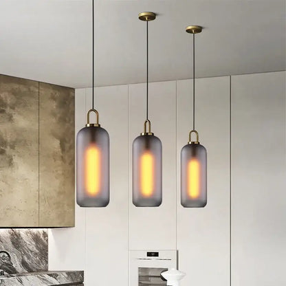 Three modern gray glass ball led pendant lights with frosted shades and brass accents for dining room decorbites glass ball decor