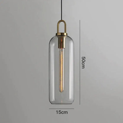 A sleek transparent glass ball pendant light with brass accents for modern dining room decorbites pendant lights