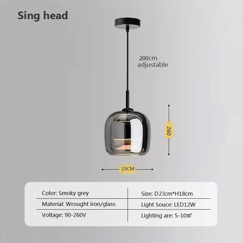 Modern gray glass pendant light with smoky gray globe and wrought iron plated detailing for kitchen use